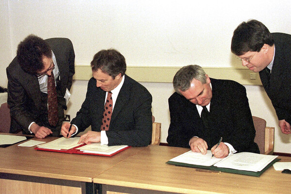 Former prime minister Sir Tony Blair and then taoiseach Bertie Ahern sign the Good Friday agreement 25 years ago.