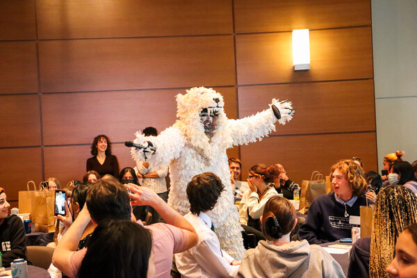 person dressed as a polar bear performs for a crowd