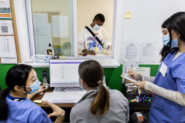 shelter health workers at the front desk