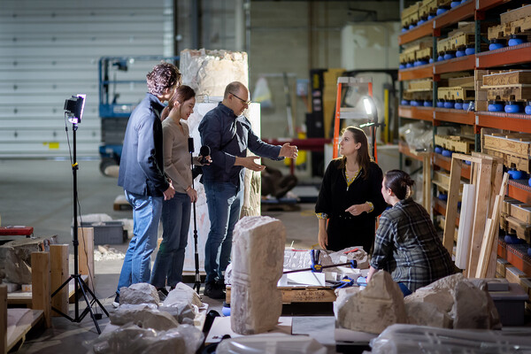 Peter Decherney and students in a warehouse in the Penn Museum.