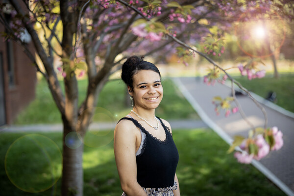 Kelly Garcia-Ramos outside under a tree. 