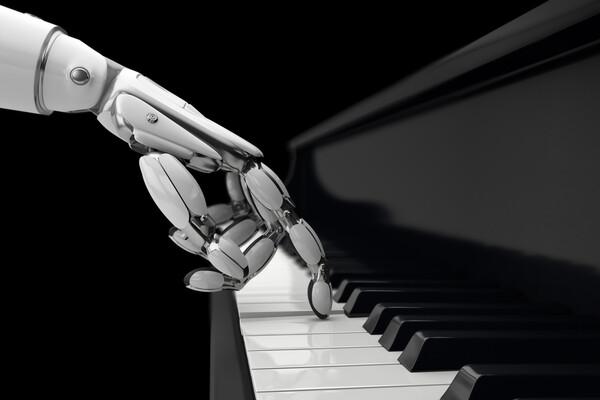 Robotic hand playing a piano.