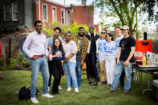 A group of people in a small urban park in West Philadelphia.