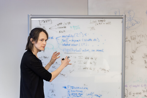 Linnea Gandhi working on a white board