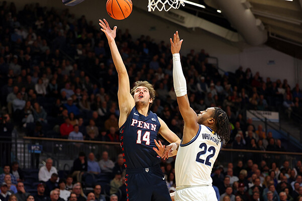 Max Martz goes up for the layup while a Villanova defender attempts to block the shots.