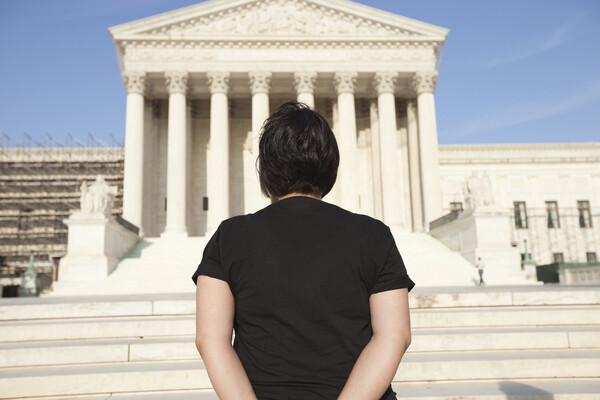 Person standing in front of U.S. Supreme Court building.