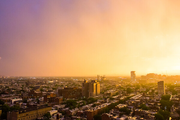 The sky glows yellow and purple after a strong summer storm in Philly.