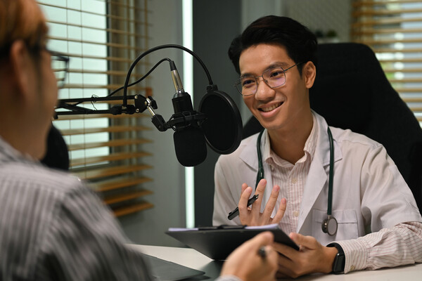 A doctor being interviewed for a podcast.