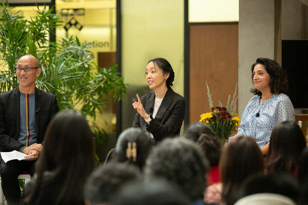 Andrea Cherng speaks to a roomful of students in the McNeil Atrium