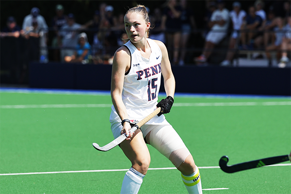 Forward Allison Kuzyk patrols the field with her stick in her hands during a game.