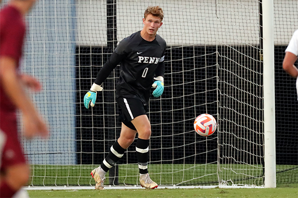 Fourth-year goalkeeper Nick Christoffersen prepares to kick the ball outside the goal during a game.