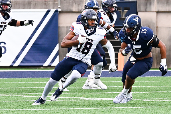 Jared Richardson runs with the ball after catching a pass against Yale.
