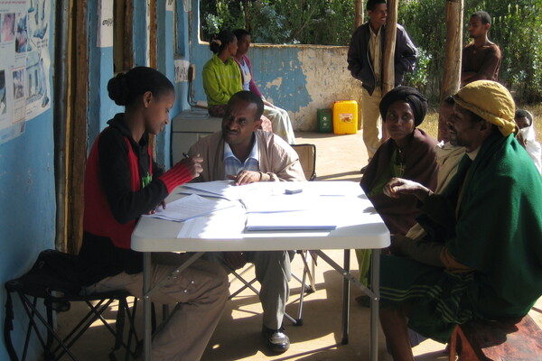 Researchers collecting ethnographic and medical information from participants in Ethiopia.