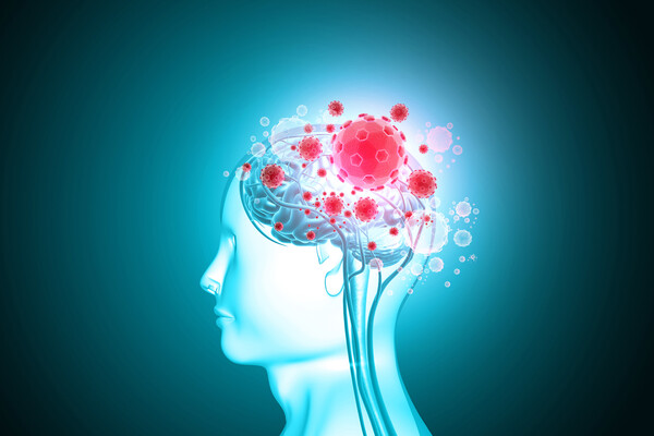 A profile of a human brain covered in virus cells.