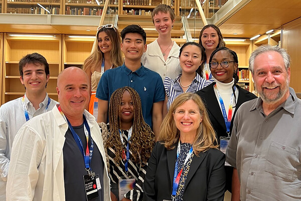 A group of people including Penn President Liz Magill and Michael Delli Carpini.