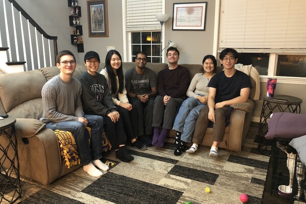 People pose on a couch after Thanksgiving dinner.
