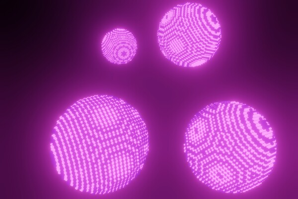 Artist's impression of spherical binary nanocrystal superlattices featuring semiconductor (emissive) and magnetic/plasmonic (non-emissive) nanocrystals.