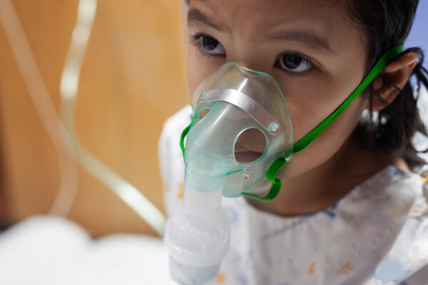 A child on a nebulizer.