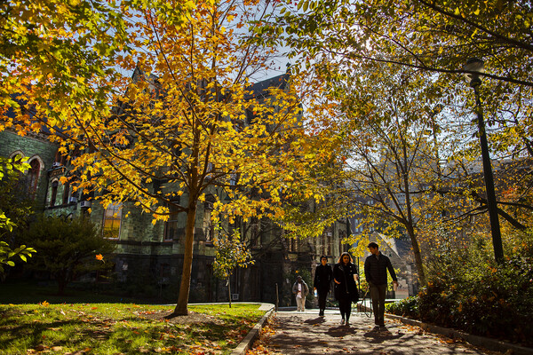 People walking on Penn’s campus in autumn.