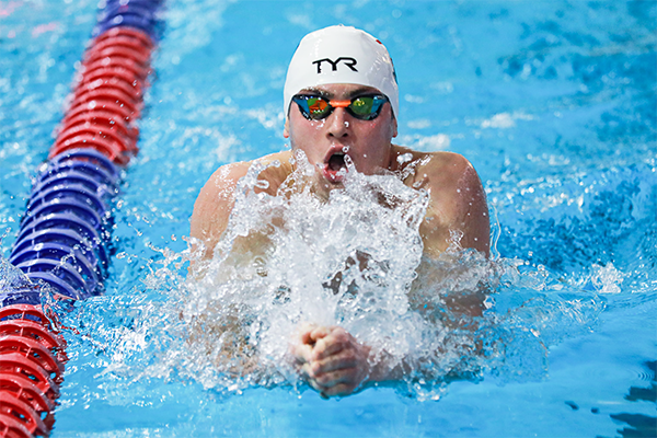 Matt Fallon performs the breaststroke during a race.