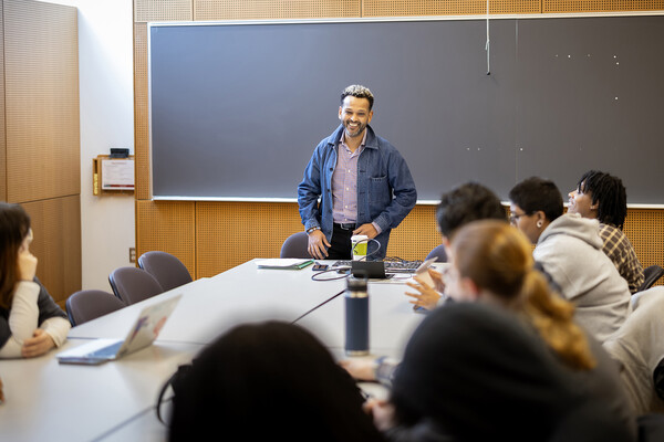 Dag Woubshet leading a class of students.