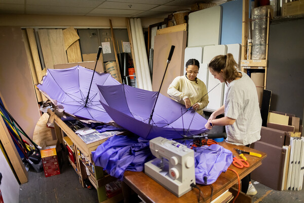 Emily Monfort and Izzy DiCampli work on set design.