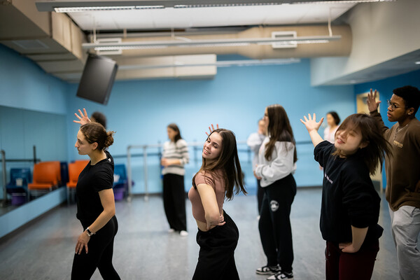 Members of a Penn performing arts group rehearsing in a studio.