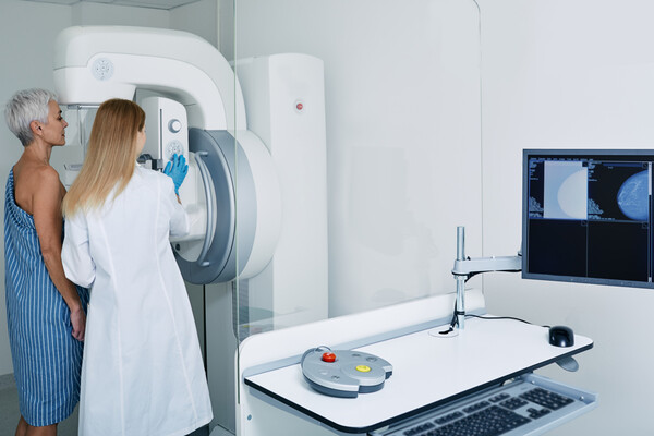 A patient receiving a mammogram.