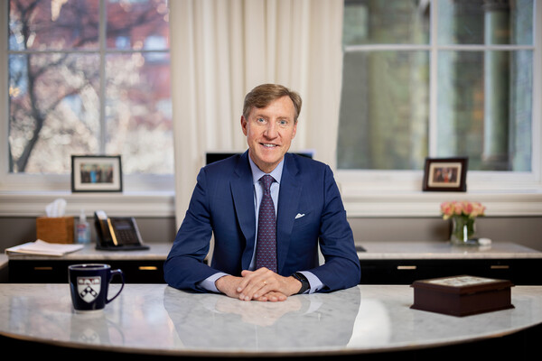 Penn president J. Larry Jameson seated at his desk.