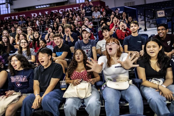 Penn students looking excited in The Palestra.