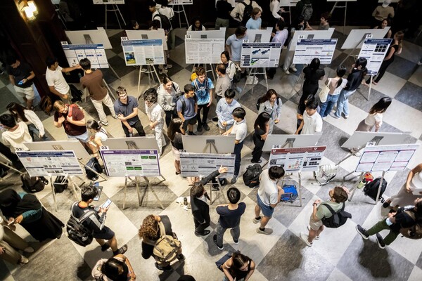 Students in Houston Hall looking at posters during Penn’s CURF Poster Expo.