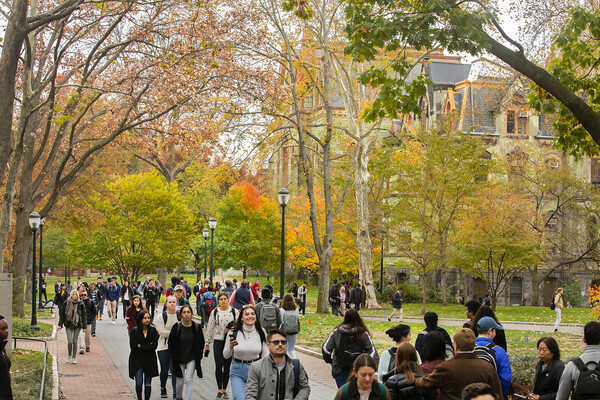 Penn students walking on Locust Walk in the fall.