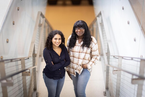 second-year Ziana Sundrani and third-year Taiwo Adeaga stand next to each other.