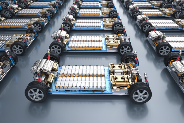 Electric cars in lines with batteries exposed.