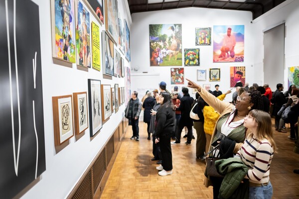 People looking at the After Modernism exhibit at the Arthur Ross Gallery.