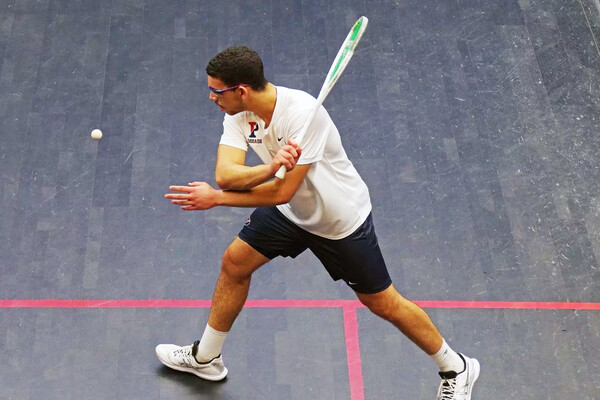 Salman Khalil swings his racquet during a match.