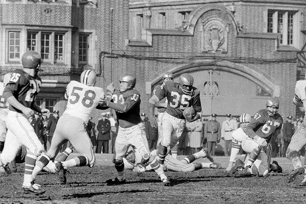 Eagles rookie running back and returner Ted Dean bursts through Packers defenders during the 1960 NFL Championship Game at Franklin Field.