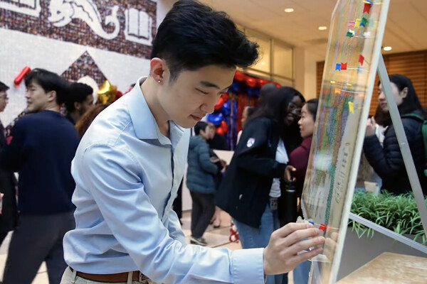 A Penn Med student putting a pin in a map on Match Day 2025.