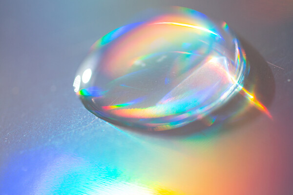 A water droplet reflecting the color spectrum.