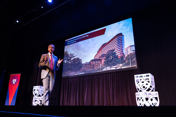 J. Larry Jameson speaking on stage.