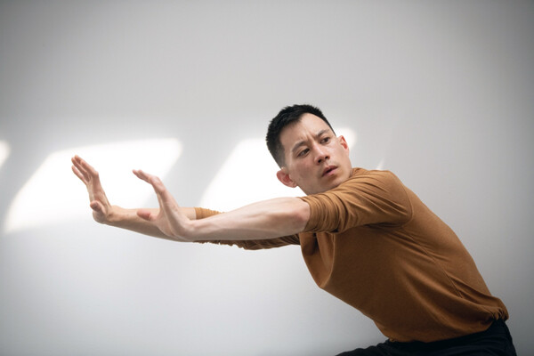 Kelvin Vu performing a dance move.