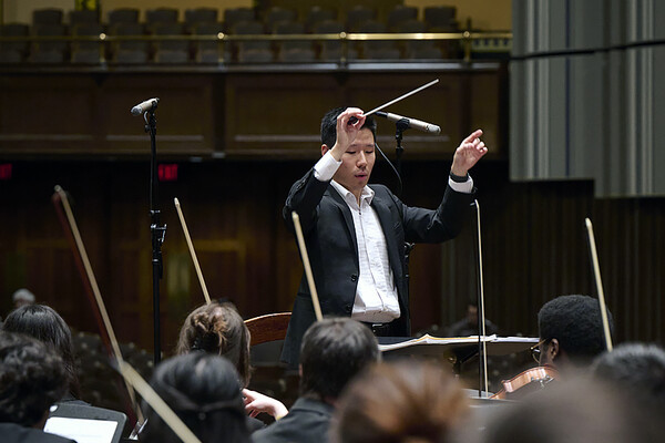 David Zhang conducting the Penn Orchestra.