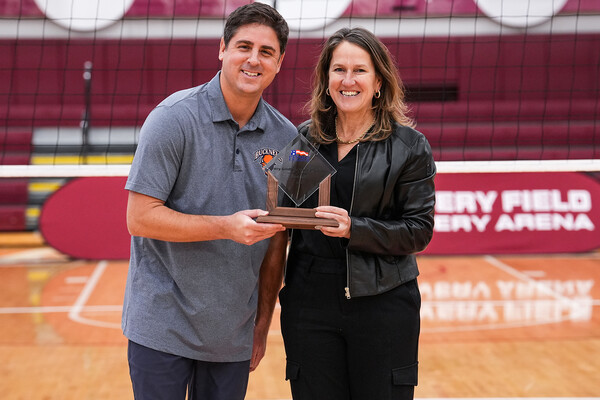 Tyler Hagstrom receives his coach of the year trophy while at Bucknell.