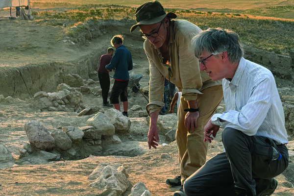The South Gate cemetery excavations, with Gareth Darbyshire (foreground left), Brian Rose (foreground right), and Simon Greenslade (middle background). Tumulus MM is in the distance at upper left