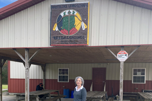 Sherry Caputo in front of the Lenape Tribal Grounds building.