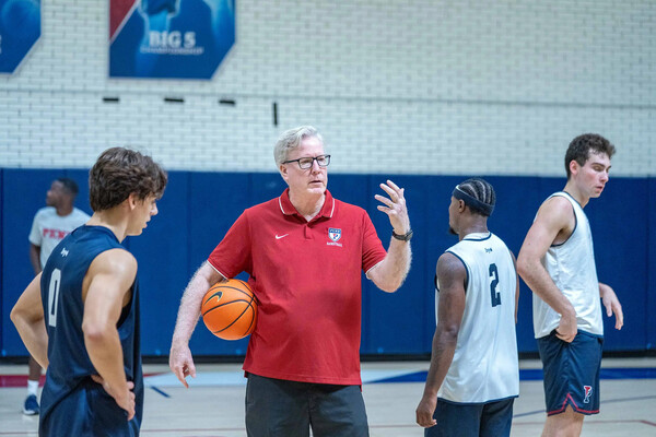 Fran McCaffery speaks with players during practice.