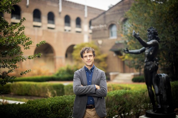 Malcolm Nelson stands in front of the Penn Museum.