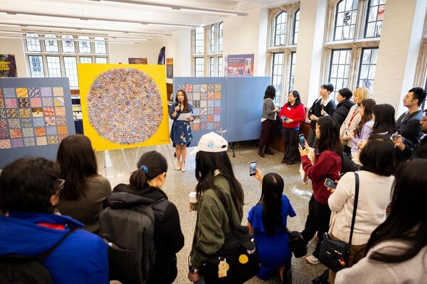 Students, faculty and staff celebrate the dedication of a crane mural in April.