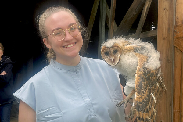 Jennifer Grell holding a barn owl.