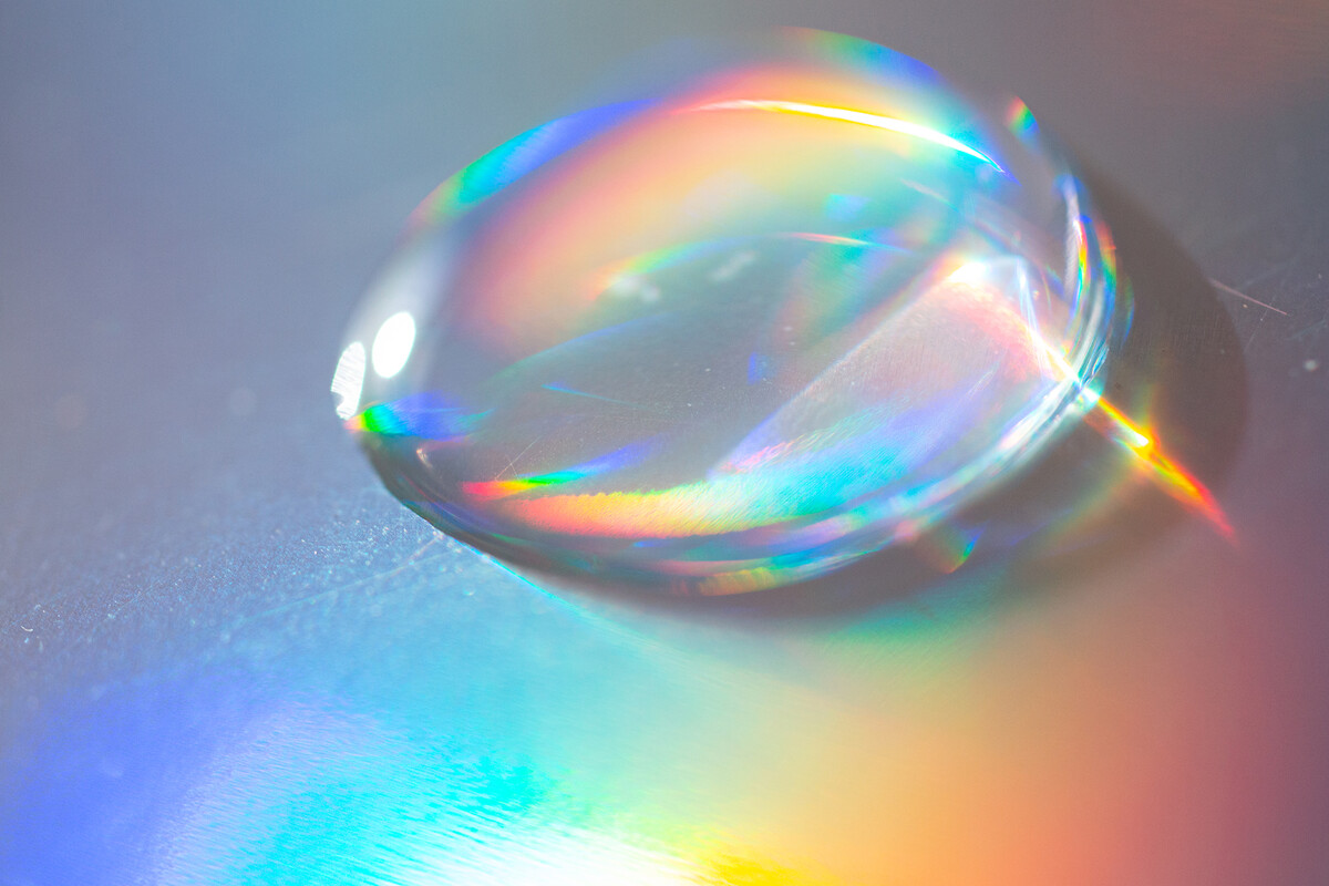 A water droplet reflecting the color spectrum.